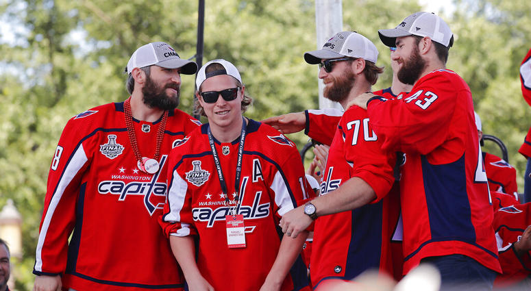 Washington Capitals' Alex Ovechkin (8), of Russia; Nicklas Backstrom (19), of Sweden; Braden Holtby (70); and Tom Wilson (43) greet each other on stage during the Stanley Cup victory celebration on the National Mall in Washington. Washington Capitals' Alex Ovechkin (8), of Russia; Nicklas Backstrom (19), of Sweden; Braden Holtby (70); and Tom Wilson (43) greet each other on stage during the Stanley Cup victory celebration on the National Mall in Washington.