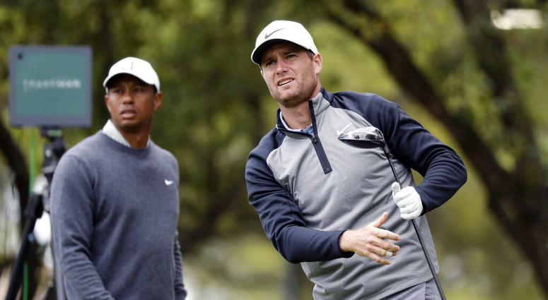 Lucas Bjerregaard, right, watches his drive on the eighth hole as Tiger Woods, left, looks on during quarterfinal play at the Dell Technologies Match Play Championship golf tournament, Saturday, March 30, 2019, in Austin, Texas. Bjerregaard won the match. Lucas Bjerregaard, right, watches his drive on the eighth hole as Tiger Woods, left, looks on during quarterfinal play at the Dell Technologies Match Play Championship golf tournament, Saturday, March 30, 2019, in Austin, Texas. Bjerregaard won the match.