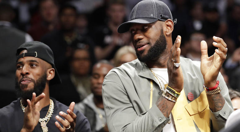 Chris Paul and LeBron James applaud during a ceremony at an NBA basketball game between the Brooklyn Nets and the Miami Heat, Wednesday, April 10, 2019, in New York. The pair were there to watch Heat guard Dwyane Wade play his last NBA game Chris Paul and LeBron James applaud during a ceremony at an NBA basketball game between the Brooklyn Nets and the Miami Heat, Wednesday, April 10, 2019, in New York. The pair were there to watch Heat guard Dwyane Wade play his last NBA game