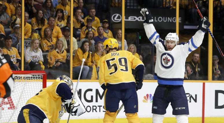 Paul Stastny, right, celebrates after teammate Tyler Myers, not shown, scored a goal against Nashville Predators goalie Pekka Rinne, DO NOT USE
