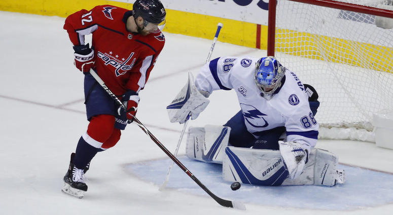 Washington Capitals center Evgeny Kuznetsov (92), from Russia, has his shot blocked by Tampa Bay Lightning goaltender Andrei Vasilevskiy (88), from Russia Capitals