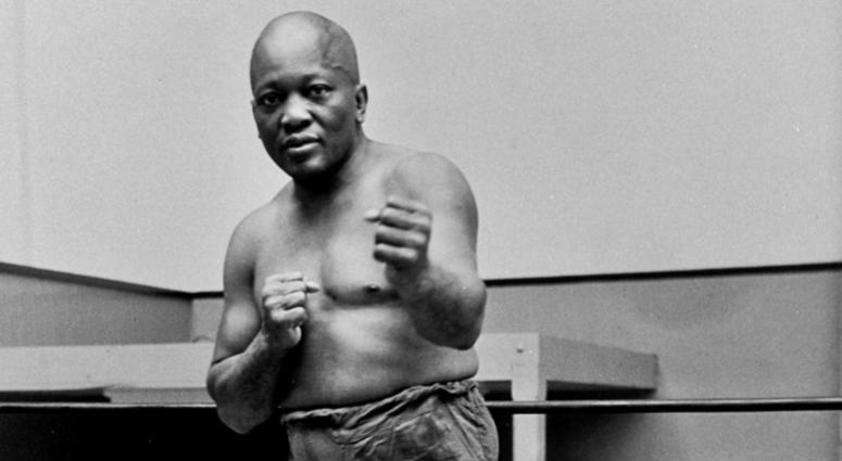 In this 1932 file photo, boxer Jack Johnson, the first black world heavyweight champion, poses in New York City. DO NOT USE