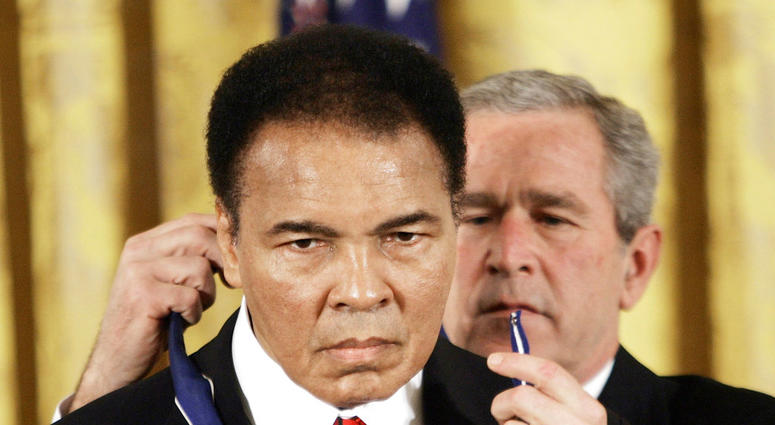 President Bush presents the Presidential Medal of Freedom to boxer Muhammad Ali in the East Room of the White House. DO NOT USE