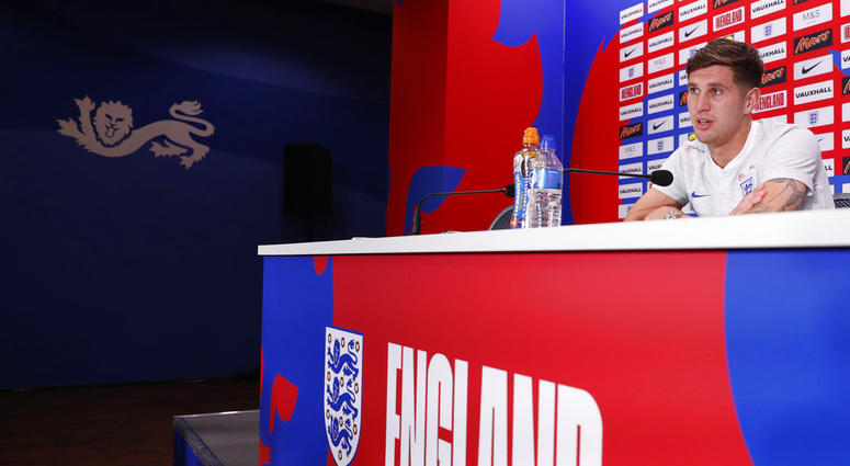England's John Stones speaks during a press conference inside the England media centre at the 2018 soccer World Cup DO NOT USE