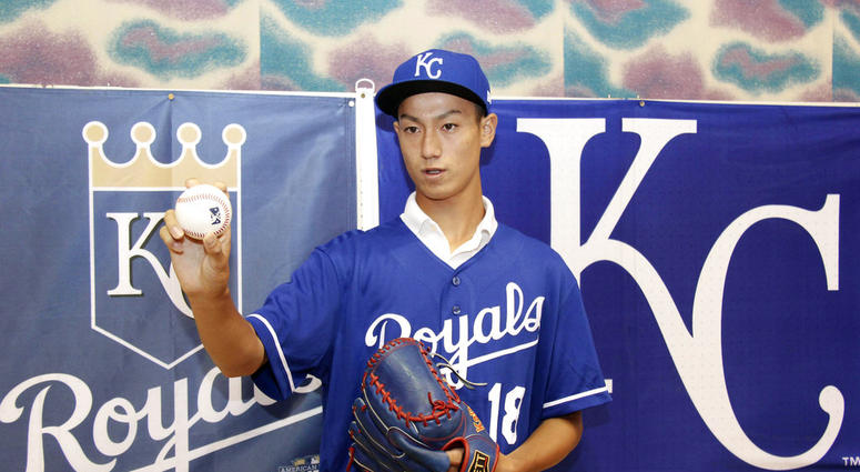 Kaito Yuki poses for photographers at a press conference in Osaka, western Japan. Yuki is headed to the Kansas City Royals organization instead of attending high school in Japan. DO NOT USE