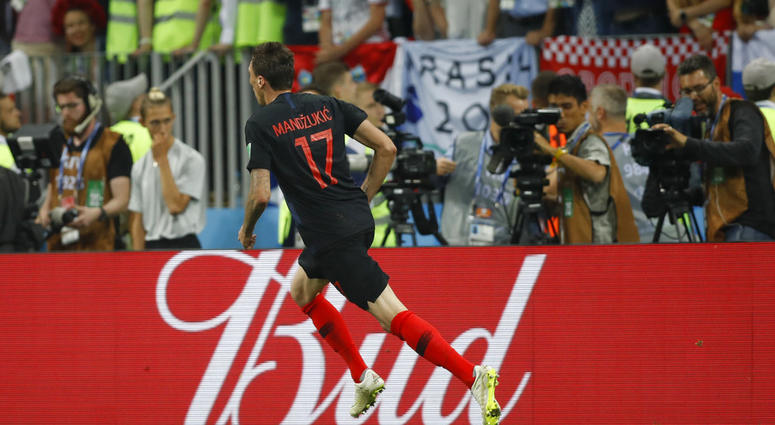 Croatia's Mario Mandzukic celebrates after scoring his side's second goal during the semifinal match between Croatia and England at the 2018 soccer World Cup DO NOT USE