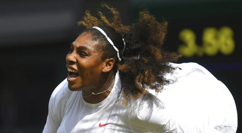Serena Williams of the US serves to Julia Goerges of Germany during their women's semifinal