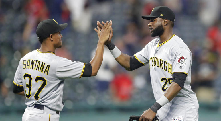 Pittsburgh Pirates' Gregory Polanco, right, celebrates with relief pitcher Edgar Santana after the Pirates defeated the Cleveland Indians 9-4 in a baseball game, Tuesday, July 24, 2018, in Cleveland. DO NOT USE