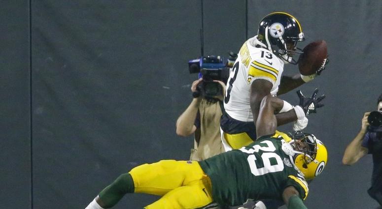 Pittsburgh Steelers' James Washington catches a touchdown pass over Green Bay Packers' Demetri Goodson during the second half of a preseason NFL football game Thursday, Aug. 16, 2018, in Green Bay, Wis. DO NOT USE