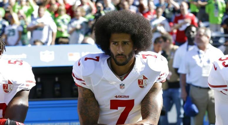 n this Sept. 25, 2016, file photo, San Francisco 49ers' Colin Kaepernick kneels during the national anthem before an NFL football game against the Seattle Seahawks, DO NOT USE