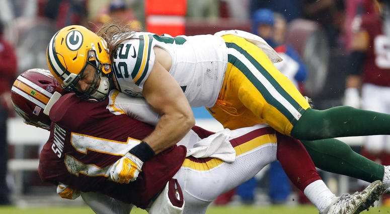 Green Bay Packers linebacker Clay Matthews (52) hits Washington Redskins quarterback Alex Smith (11) during the second half of an NFL football game, Sunday, Sept. 23, 2018 in Landover, Md. DO NOT USE