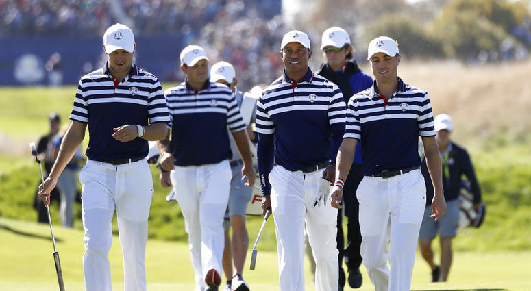 Jordan Spieth of the US, Patrick Reed, Tiger Woods and Justin Thomas, from left, walk to the 18th green during a practice round for the Ryder Cup DO NOT USE