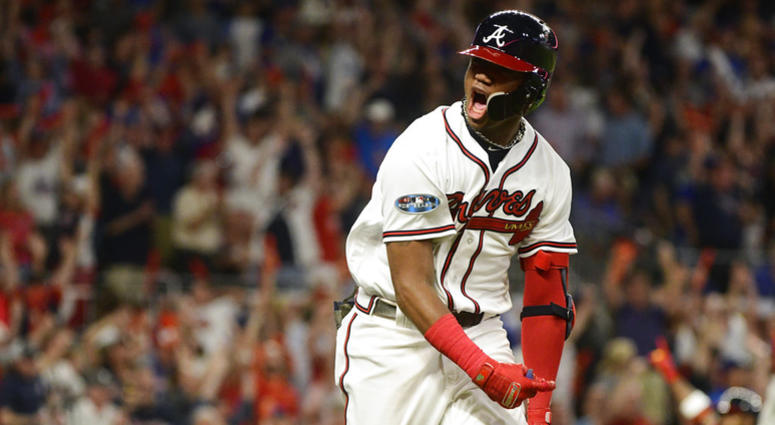 Atlanta Braves' Ronald Acuna Jr. (13) runs to first after hitting a grand-slam homer against Los Angeles Dodgers starting pitcher Walker Buehler during the second inning in Game 3 of MLB baseball's National League Division Series, Sunday, Oct. 7, 2018. DO NOT USE