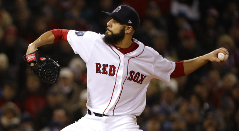 Boston Red Sox's starting pitcher David Price winds up to throw during the first inning of Game 2 of the World Series baseball against the Los Angeles Dodgers game Wednesday, Oct. 24, 2018, in Boston. DO NOT USE