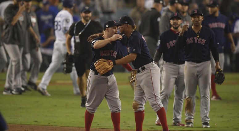 Boston Red Sox celebrate after their win in Game 4 of the World Series baseball game against the Los Angeles Dodgers on Saturday, Oct. 27, 2018, in Los Angeles. DO NOT USE