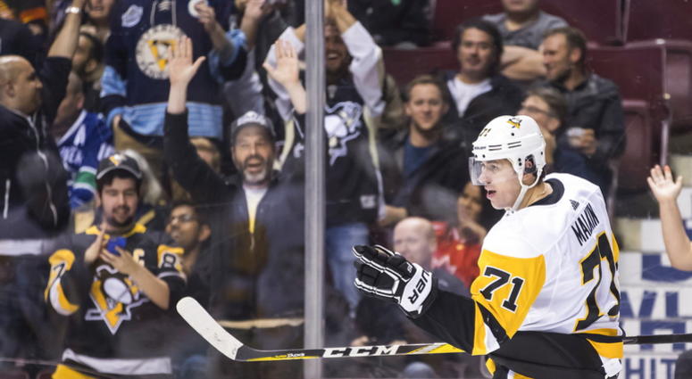 Pittsburgh Penguins' Evgeni Malkin, of Russia, celebrates his first goal against the Vancouver Canucks during the third period of an NHL hockey game in Vancouver, British Columbia, Saturday, Oct. 27, 2018. DO NOT USE