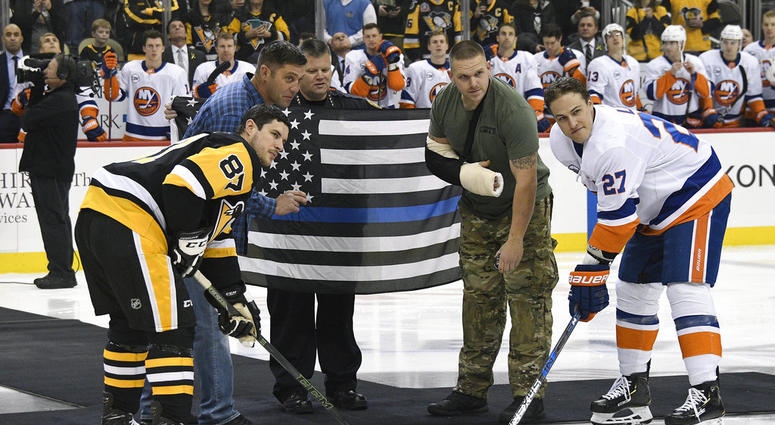 Pittsburgh Police Officer Mike Smidga, Pittsburgh Police Chief Scott Schubert and Officer Anthony Burke Pittsburgh Police Officer Mike Smidga, Pittsburgh Police Chief Scott Schubert and Officer Anthony Burke