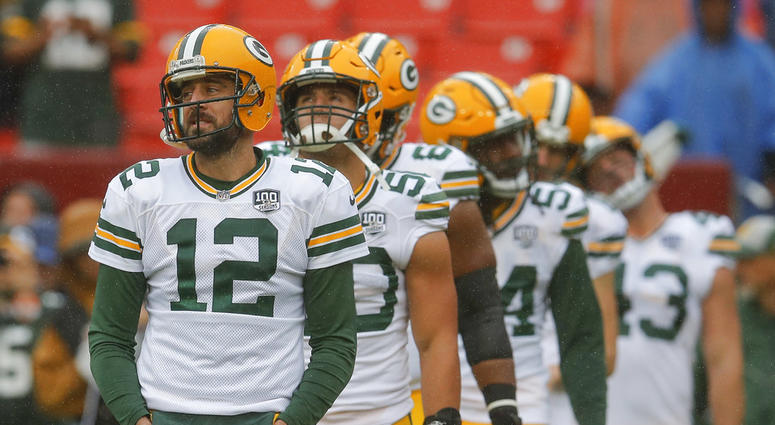 Green Bay Packers quarterback Aaron Rodgers (12) warms up with the team Green Bay Packers quarterback Aaron Rodgers (12) warms up with the team