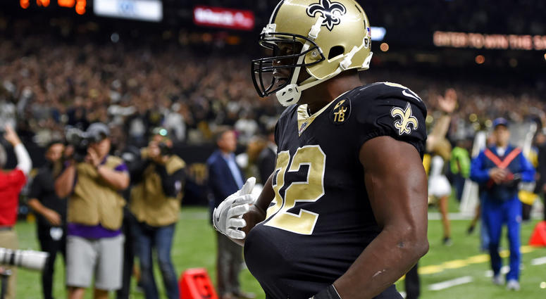 New Orleans Saints tight end Benjamin Watson celebrates his touchdown reception by putting the football under his jersey to pretend he is pregnant New Orleans Saints tight end Benjamin Watson celebrates his touchdown reception by putting the football under his jersey to pretend he is pregnant
