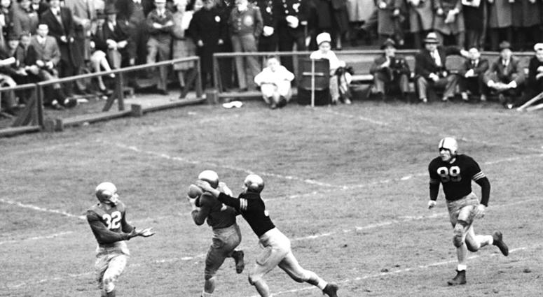 In this Nov. 9, 1946, file photo, Notre Dame's Emil Sitko (14) grabs a pass intended for Army's Bill West, In this Nov. 9, 1946, file photo, Notre Dame's Emil Sitko (14) grabs a pass intended for Army's Bill West,