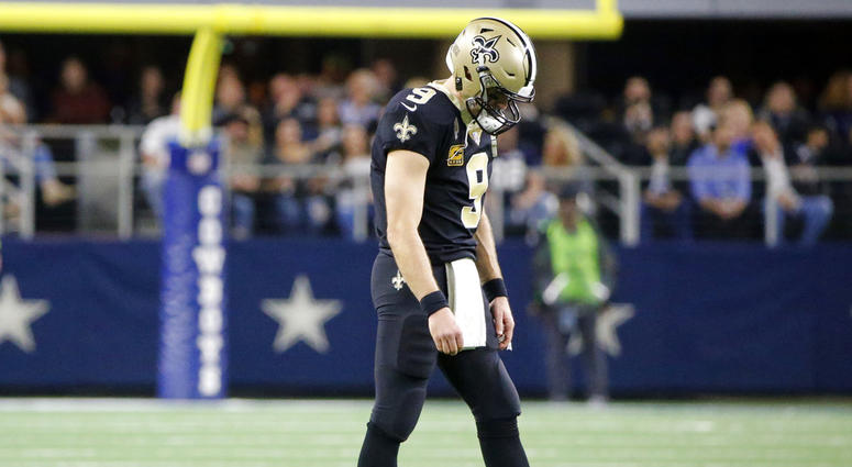 New Orleans Saints quarterback Drew Brees (9) walks off of the field in the first half of an NFL football game against the Dallas Cowboys, in Arlington, Texas, Thursday, Nov. 29, 2018. DO NOT USE