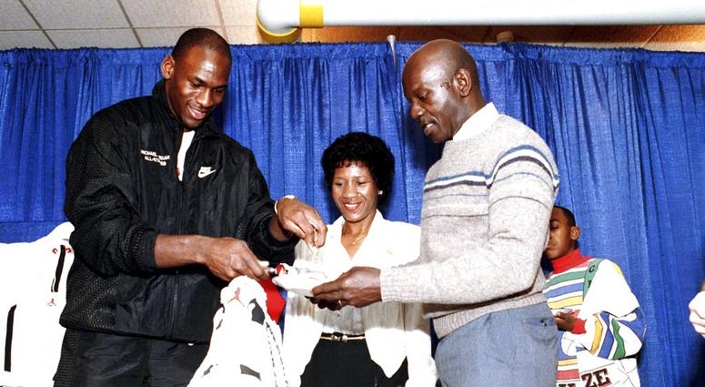 Chicago Bulls' Michael Jordan serves his father, James, a slice of birthday cake as his mother, Doloris, watches during a party in honor of Jordan's 26th birthday in Chicago, Ill. Chicago Bulls' Michael Jordan serves his father, James, a slice of birthday cake as his mother, Doloris, watches during a party in honor of Jordan's 26th birthday in Chicago, Ill.