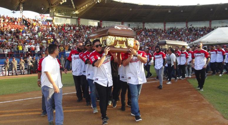 Players from the Cardenales de Lara baseball team carry the caskets of teammates and former major league players Luis Valbuena and Jose Castillo at a baseball stadium in Barquisimeto, Venezuela, Friday, Dec. 7, 2018 Players from the Cardenales de Lara baseball team carry the caskets of teammates and former major league players Luis Valbuena and Jose Castillo at a baseball stadium in Barquisimeto, Venezuela, Friday, Dec. 7, 2018