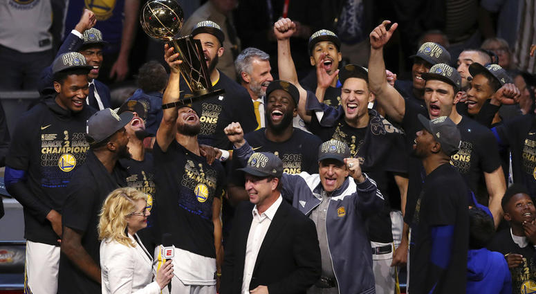 In this Friday, June 8, 2018, file photo, the Golden State Warriors celebrate after defeating the Cleveland Cavaliers 108-85 in Game 4 of basketball's NBA Finals to win the NBA championship, in Cleveland. DO NOT USE
