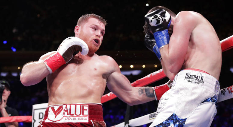 Mexico's Canelo Alvarez, left, punches England's Rocky Fielding during the third round of a WBA super middleweight championship boxing match Saturday, Dec. 15, 2018, in New York. Mexico's Canelo Alvarez, left, punches England's Rocky Fielding during the third round of a WBA super middleweight championship boxing match Saturday, Dec. 15, 2018, in New York.