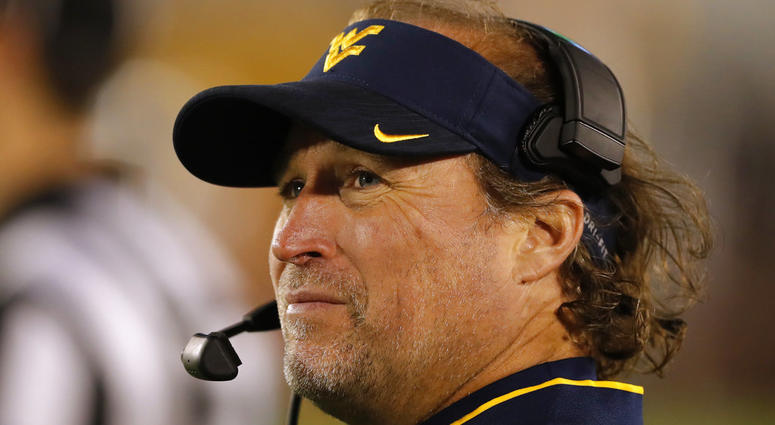 In this Oct. 13, 2018 file photo West Virginia head coach Dana Holgorsen watches from the sideline during the second half of an NCAA college football game against Iowa State DO NOT USE