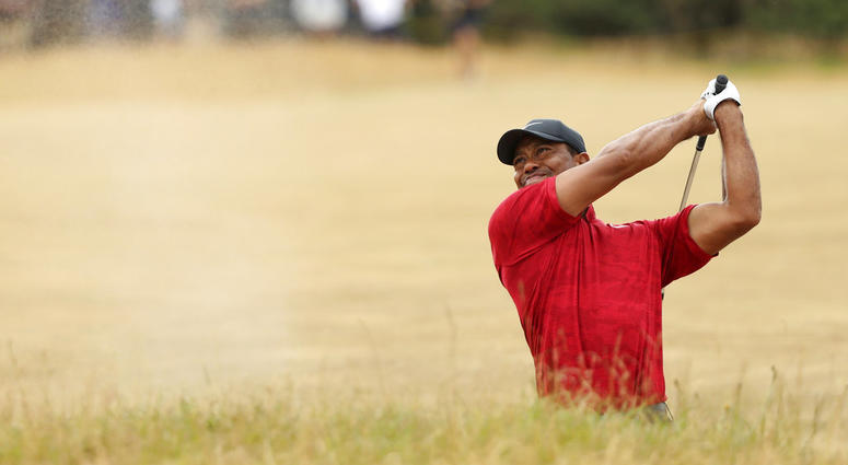 Tiger Woods of the U.S. plays out of a bunker on the 10th hole during the final round for the 147th British Open Golf championships in Carnoustie, Scotland Tiger Woods of the U.S. plays out of a bunker on the 10th hole during the final round for the 147th British Open Golf championships in Carnoustie, Scotland