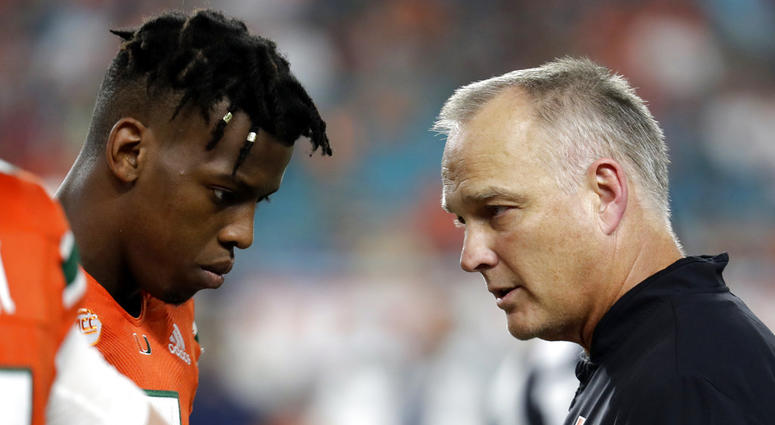 Miami quarterback N'Kosi Perry, left, talking with Miami head coach Mark Richt Miami quarterback N'Kosi Perry, left, talking with Miami head coach Mark Richt