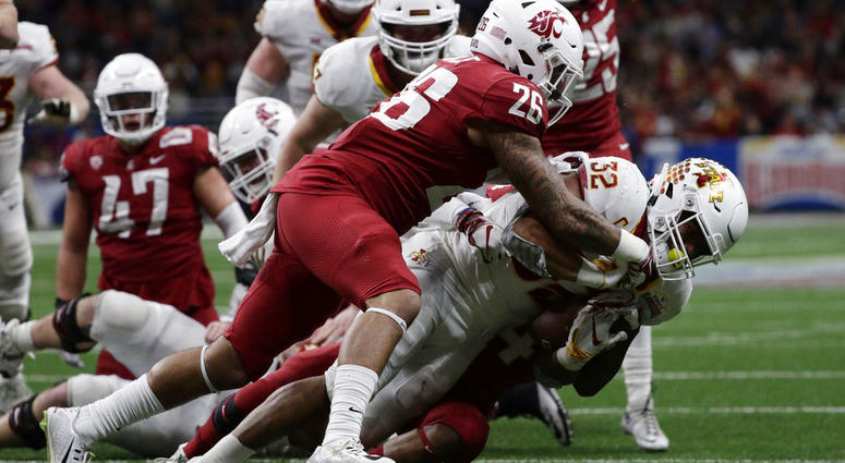 Iowa State running back David Montgomery (32) is hit by Washington State defensive back Hunter Dale Iowa State running back David Montgomery (32) is hit by Washington State defensive back Hunter Dale
