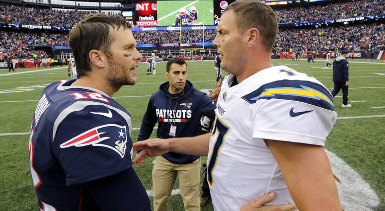 New England Patriots quarterback Tom Brady (12) and Los Angeles Chargers quarterback Philip Rivers New England Patriots quarterback Tom Brady (12) and Los Angeles Chargers quarterback Philip Rivers