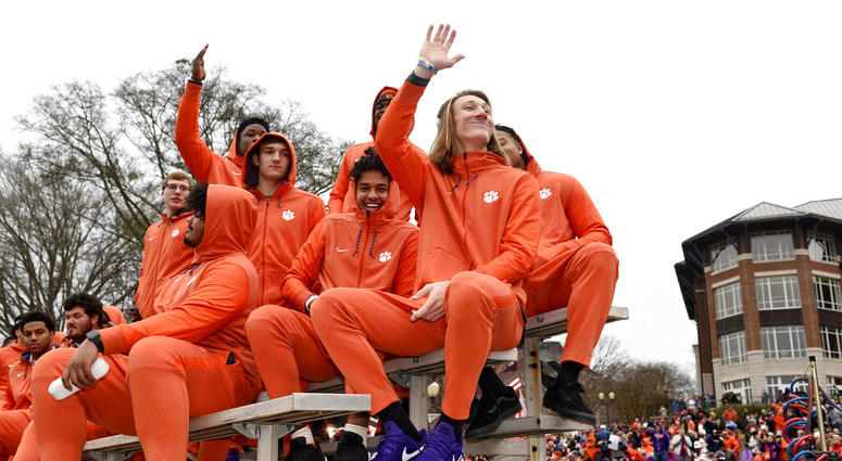 Clemson quarterback Trevor Lawrence, right, along with fellow freshman ride in the parade honoring Clemson Saturday, Jan. 12, 2019, in Clemson Clemson quarterback Trevor Lawrence, right, along with fellow freshman ride in the parade honoring Clemson Saturday, Jan. 12, 2019, in Clemson