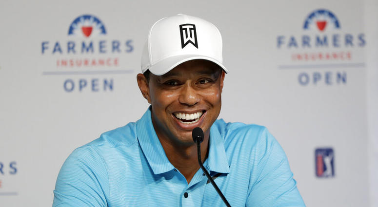 Tiger Woods laughs during a news conference after finishing on the north course at Torrey Pines Golf Course during the pro-am event at the Farmers Insurance Open golf tournament, in San Diego Tiger Woods laughs during a news conference after finishing on the north course at Torrey Pines Golf Course during the pro-am event at the Farmers Insurance Open golf tournament, in San Diego