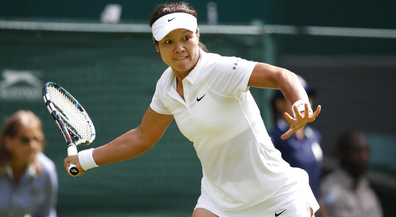 Li Na of China plays a return to Paula Kania of Poland during their first round match at the All England Lawn Tennis Championships in Wimbledon, London Li Na of China plays a return to Paula Kania of Poland during their first round match at the All England Lawn Tennis Championships in Wimbledon, London