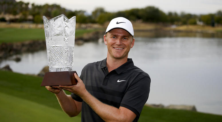 Adam Long holds the trophy on the 18th green after winning the Desert Classic golf tournament on the Stadium Course at PGA West on Sunday Adam Long holds the trophy on the 18th green after winning the Desert Classic golf tournament on the Stadium Course at PGA West on Sunday
