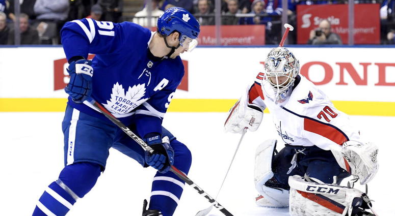 Washington Capitals goaltender Braden Holtby (70) stops Toronto Maple Leafs center John Tavares (91) AP DO NOT USE
