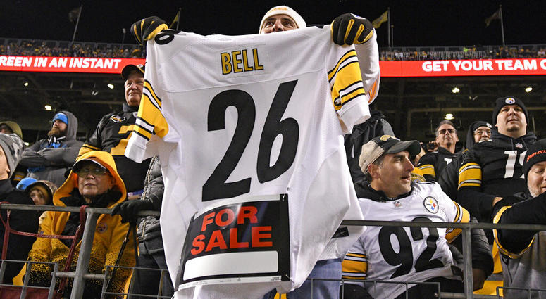 a Pittsburgh Steelers fan holds a Le'Veon Bell jersey a Pittsburgh Steelers fan holds a Le'Veon Bell jersey