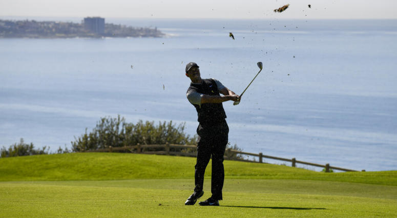 Tiger Woods hits his second shot on the 16th hole during the second round of the Farmers Insurance Open golf tournament on the North Course at the Torrey Pines on Friday, Jan. 25, 2019, in San Diego Tiger Woods hits his second shot on the 16th hole during the second round of the Farmers Insurance Open golf tournament on the North Course at the Torrey Pines on Friday, Jan. 25, 2019, in San Diego