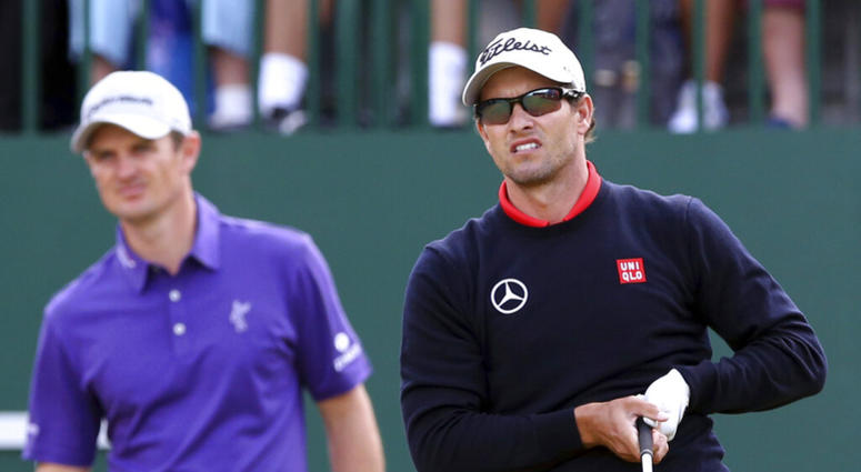 Adam Scott, of Australia, watches his shot off the first tee with Justin Rose, of England Adam Scott, of Australia, watches his shot off the first tee with Justin Rose, of England