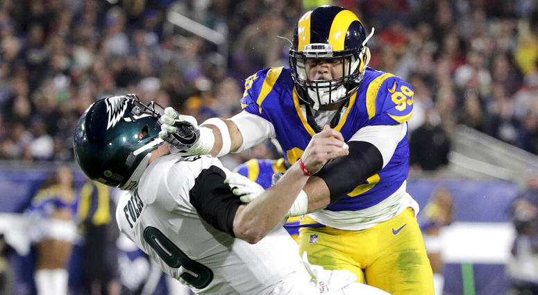 Los Angeles Rams defensive end Aaron Donald hits Philadelphia Eagles quarterback Nick Foles Los Angeles Rams defensive end Aaron Donald hits Philadelphia Eagles quarterback Nick Foles