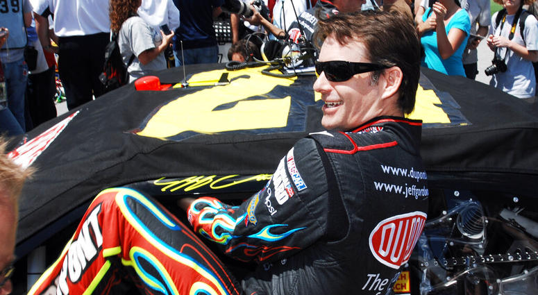 Jeff Gordon climbing into his car as he prepares to start the NASCAR Sprint Cup Series Aaron's 499 auto race at Talladega Superspeedway in Talladega Jeff Gordon climbing into his car as he prepares to start the NASCAR Sprint Cup Series Aaron's 499 auto race at Talladega Superspeedway in Talladega