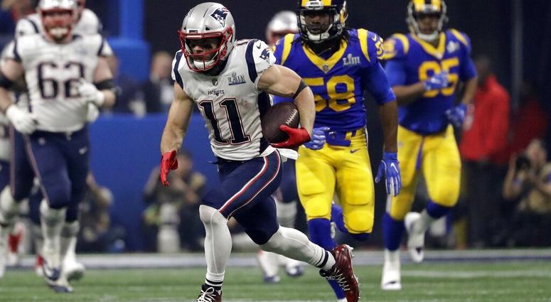 New England Patriots' Julian Edelman (11) runs the ball ahead of Los Angeles Rams' Cory Littleton (58) during the second half of the NFL Super Bowl 53 football game Sunday, Feb. 3, 2019, in Atlanta. New England Patriots' Julian Edelman (11) runs the ball ahead of Los Angeles Rams' Cory Littleton (58) during the second half of the NFL Super Bowl 53 football game Sunday, Feb. 3, 2019, in Atlanta.