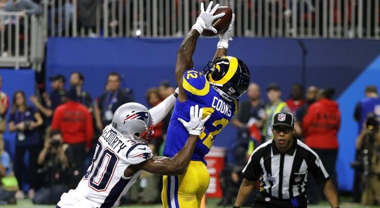 New England Patriots' Jason McCourty (30) breaks up a pass intended for Los Angeles Rams' Brandin Cooks (12) during the second half of the NFL Super Bowl 53 football game Sunday, Feb. 3, 2019, in Atlanta. DO NOT USE