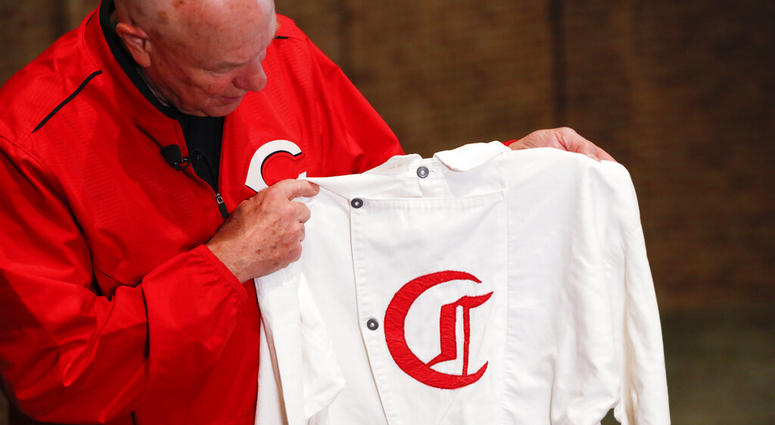 Greg Rhodes, the Cincinnati Reds baseball team historian, holds a replica jersey of the early Cincinnati Red Stockings team at Cincinnati Reds Hall of Fame AP DO NOT USE