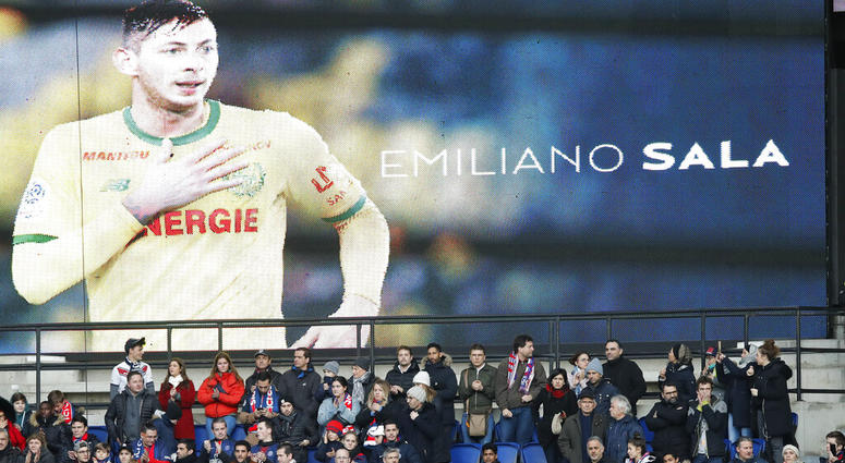 Tributes are paid to Emiliano Sala ahead of the French League One soccer match between Paris Saint-Germain and Bordeaux at the Parc des Princes stadium in Paris, Saturday, Feb. 9, 2019 Tributes are paid to Emiliano Sala ahead of the French League One soccer match between Paris Saint-Germain and Bordeaux at the Parc des Princes stadium in Paris, Saturday, Feb. 9, 2019