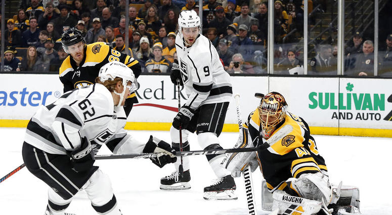 Boston Bruins goaltender Tuukka Rask takes a shot off his mask by Los Angeles Kings' Carl Hagelin AP DO NOT USE