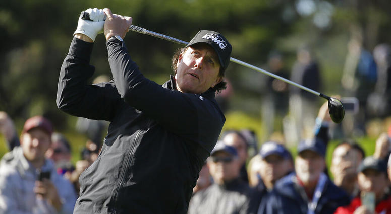 Phil Mickelson follows his drive from the fourth tee of the Pebble Beach Golf Links during the final round of the AT&T Pebble Beach Pro-Am golf tournament AP DO NOT USE